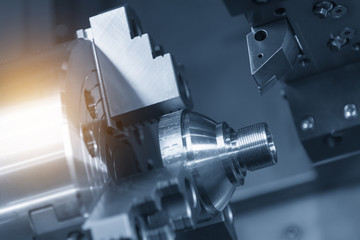 CNC lathe machine (Turning machine) cutting the metal  cone shape part .Hi-precision CNC machining concept.