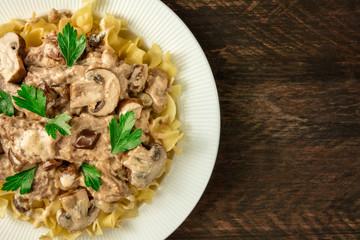 Mushroom beef stroganoff with egg pasta and copy space
