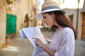 travel guide, tourism in Europe, woman tourist with map