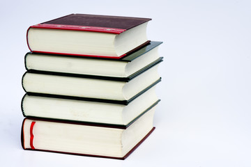 pile of books on white background
