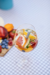 Delicious Red Sangria with fruits on table