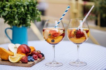 Delicious Red Sangria with fruits on table