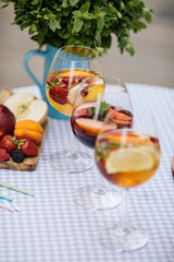 Delicious Red Sangria with fruits on table
