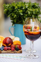 Delicious Red Sangria with fruits on table