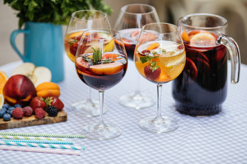 Delicious Red Sangria with fruits on table
