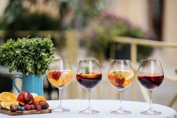 Summer drink Sangria with orange and cranberry. Selective focus. Copy space