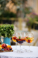 Delicious Red Sangria with fruits on table