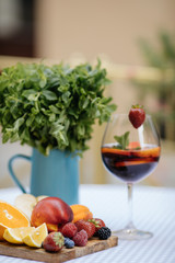 Delicious Red Sangria with fruits on table
