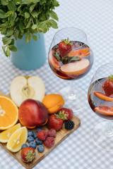 Delicious Red Sangria with fruits on table