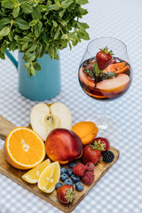 Delicious Red Sangria with fruits on table