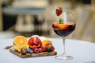 Delicious Red Sangria with fruits on table