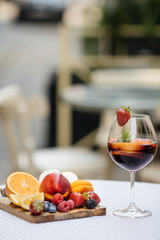 Delicious Red Sangria with fruits on table