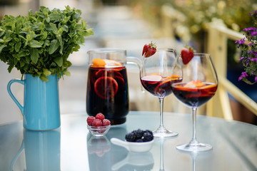 Delicious Red Sangria with fruits on table