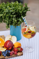 Delicious Red Sangria with fruits on table