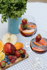 Delicious Red Sangria with fruits on table