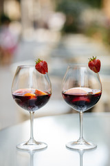 Summer drink Sangria with orange and cranberry. Selective focus. Copy space