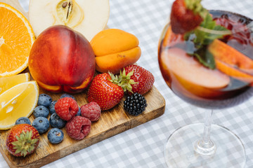 Delicious Red Sangria with fruits on table