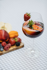 Delicious Red Sangria with fruits on table