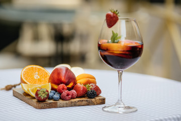 Delicious Red Sangria with fruits on table