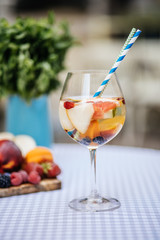 Delicious Red Sangria with fruits on table