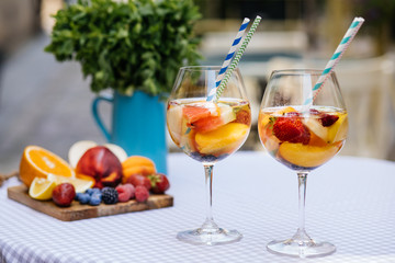 Delicious Red Sangria with fruits on table