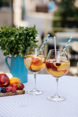 Delicious Red Sangria with fruits on table