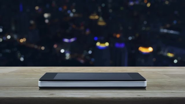 Car flat icon on modern smart phone screen on wooden table over blur colorful night light city tower, Business service taxi car concept