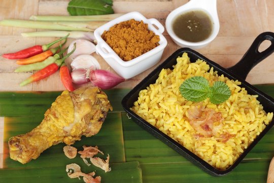 chicken biryani with rice delicious and sauce