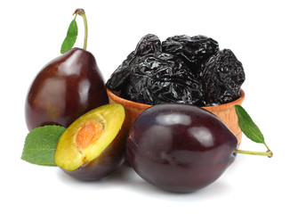 raw fresh plum with prunes in wooden bowl isolated on white background