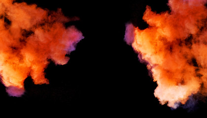 Multi cloud blasting  powder paint and flour combined, explode in front of a black background to give off fantastic multi color forms.