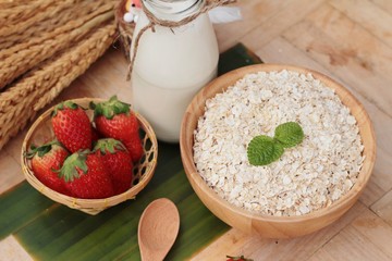 Oatmeal with milk and fresh strawberry for health
