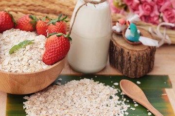 Oatmeal with milk and fresh strawberry for health