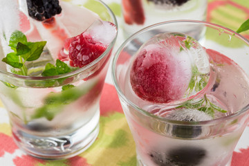 Ice cubes with fresh berries.