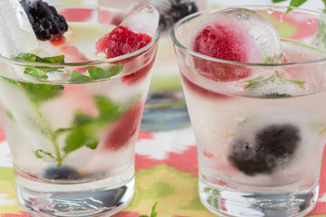 Ice cubes with fresh berries.