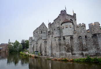 Obraz premium View of Gravensteen castle and Ghent canal. Architecture and landmark of Ghent Belgium