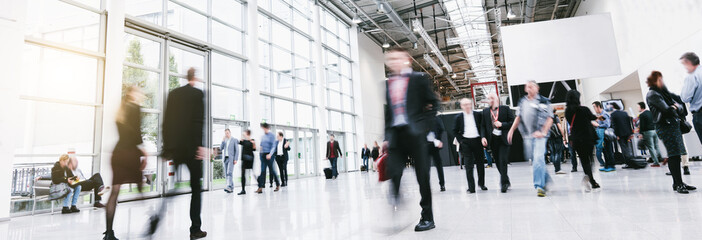 Anonymous crowd of business people rushing