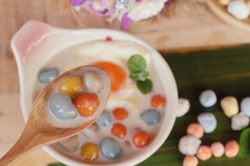 Colorful dumplings in coconut milk and egg