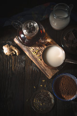 Still life with ingredients for chocolate truffles on the wooden table