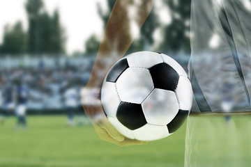 Professional football player holding ball on white background, closeup