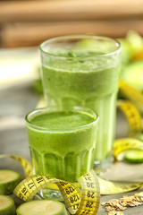 Fresh tasty smoothies in glasses on table