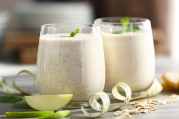 Fresh tasty smoothie in glasses on table