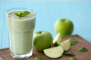 Glass with fresh tasty fruit smoothie on table