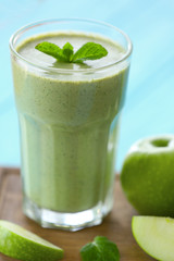 Glass with fresh tasty fruit smoothie on table