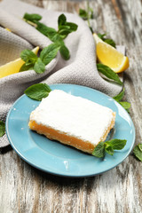 Delicious lemon pie bar on wooden rustic background
