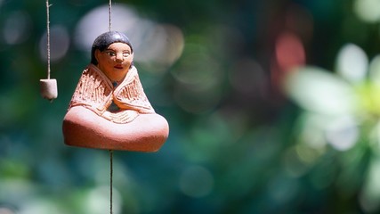 Spirtual buddah figurine hanging from monestary
