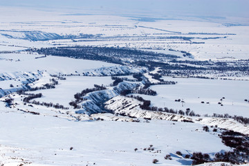 Fototapeta na wymiar White snow in the steppes of Kazakhstan in winter