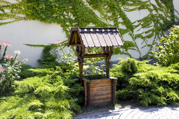 Naklejka premium Landscape with a decorative well