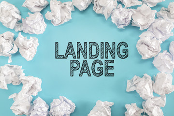 Landing Page text with crumpled paper balls on a blue background