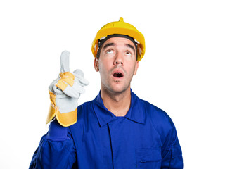 Surprised worker pointing up on white background