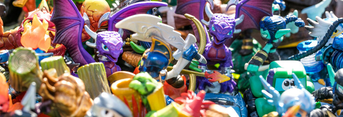 closeup of pile of plastic characters for waste or consumption - obrazy, fototapety, plakaty